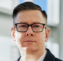 Portrait du PDG Alexander Hughes, à la tête d'une société de trading crypto
